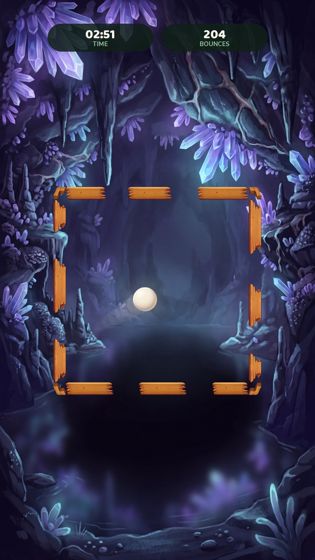 A round in the crystal cave: violet mineral formations glowing around the wooden frame, with the ball inside it.